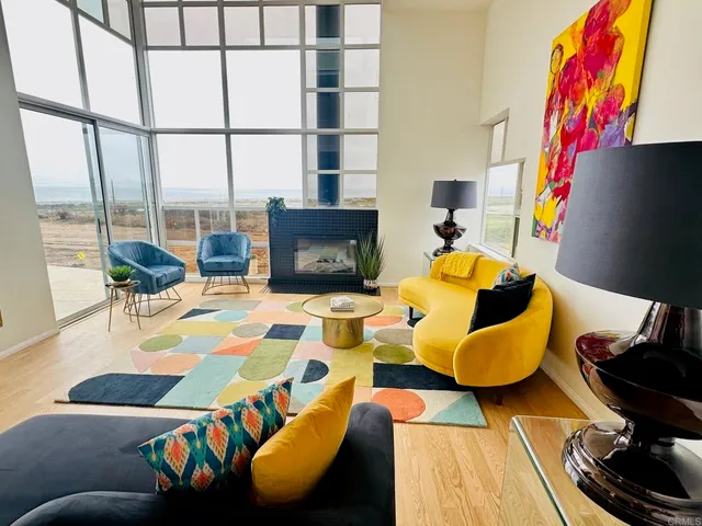 a living room with furniture and a lamp