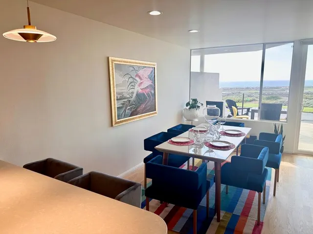 a view of a dining room with furniture window and outside view