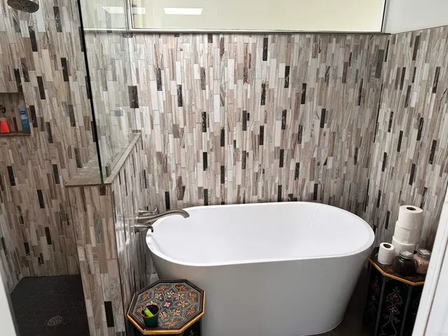 a bathroom with a bathtub and a shower curtain