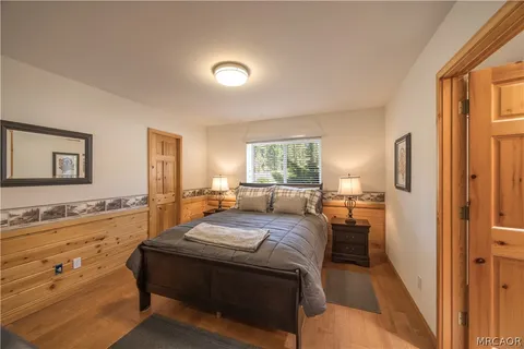 a bed room with a bed and a window