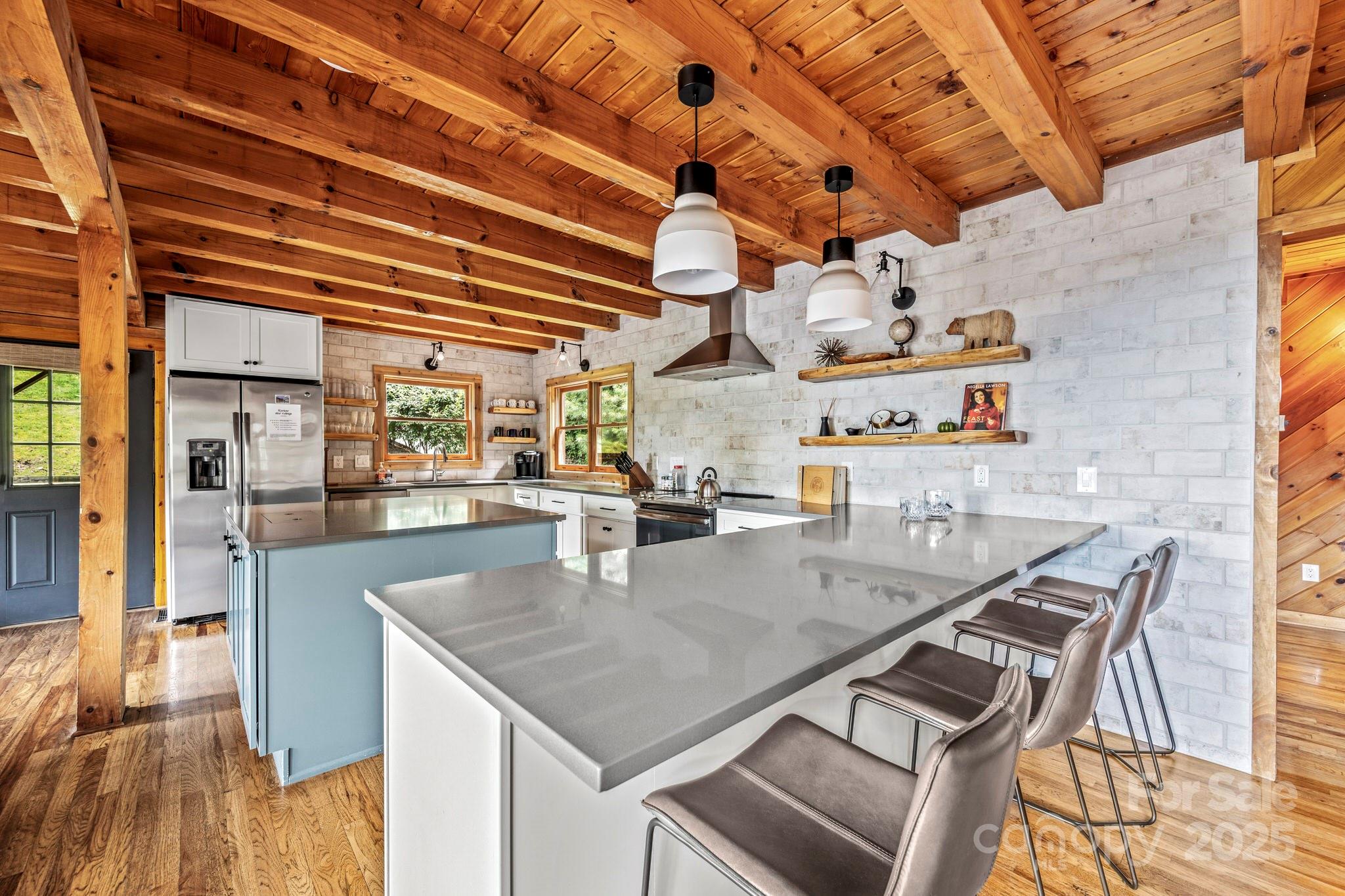 1933 Laurel Ridge North Maggie Valley, NC 28751 - Photo 13 of 45 a kitchen with a table and chairs in it