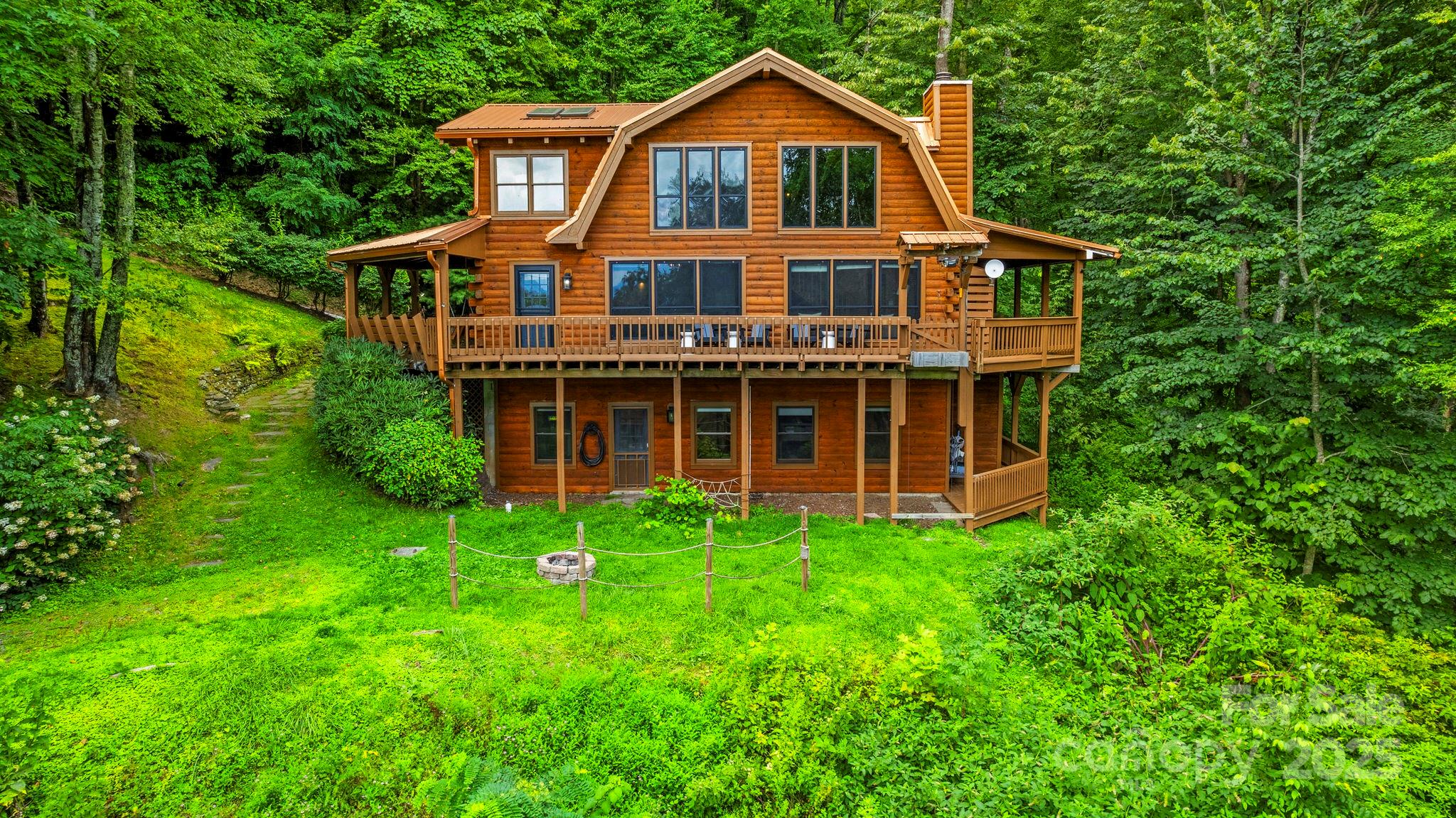 1933 Laurel Ridge North Maggie Valley, NC 28751 - Photo 2 of 45 a view of a house with yard and sitting area