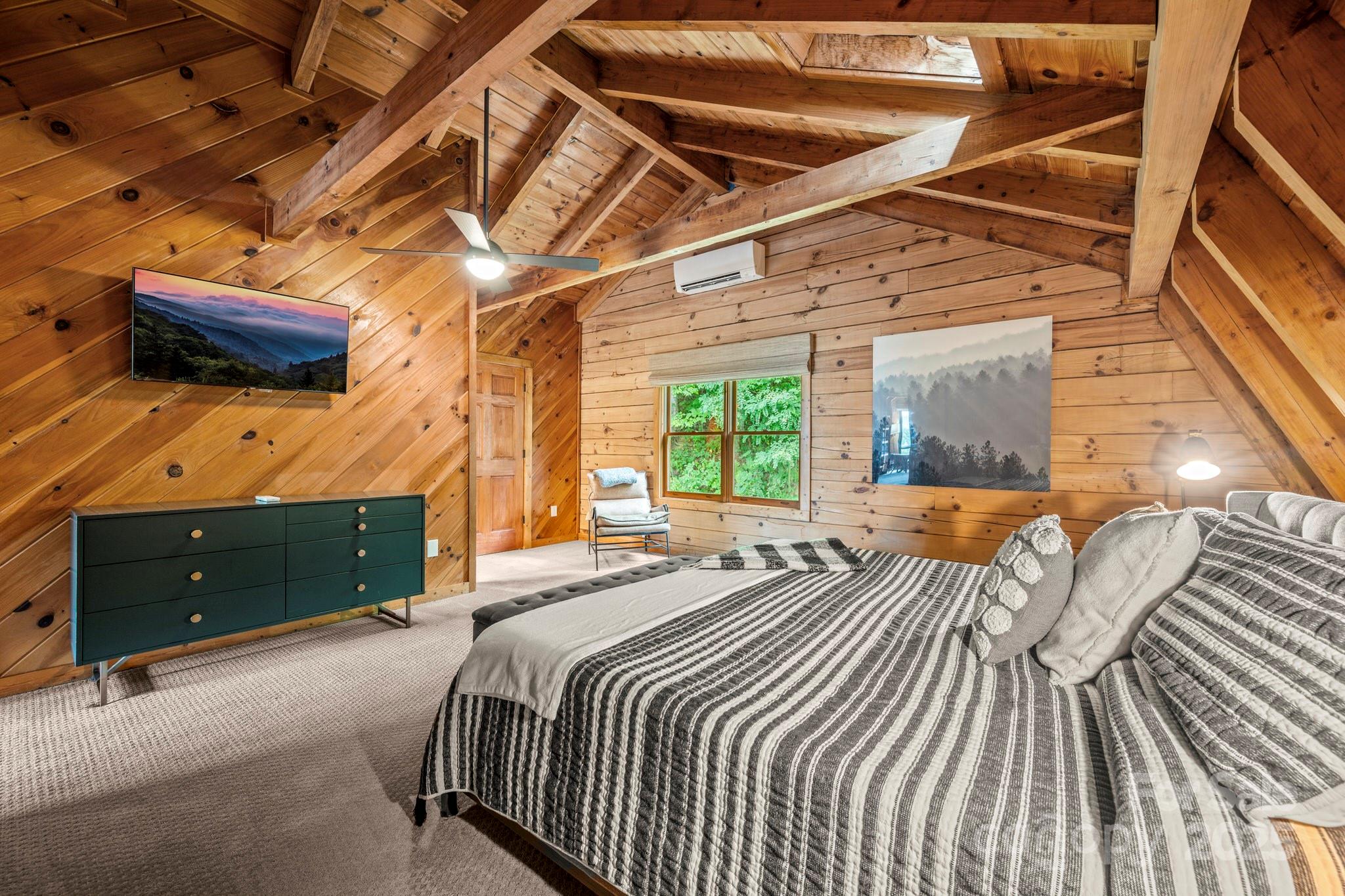 1933 Laurel Ridge North Maggie Valley, NC 28751 - Photo 35 of 45 a bedroom with a bed and a window