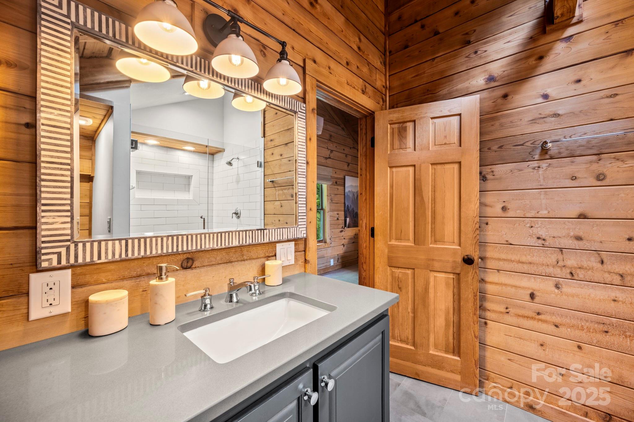 1933 Laurel Ridge North Maggie Valley, NC 28751 - Photo 38 of 45 a bathroom with a sink and a mirror