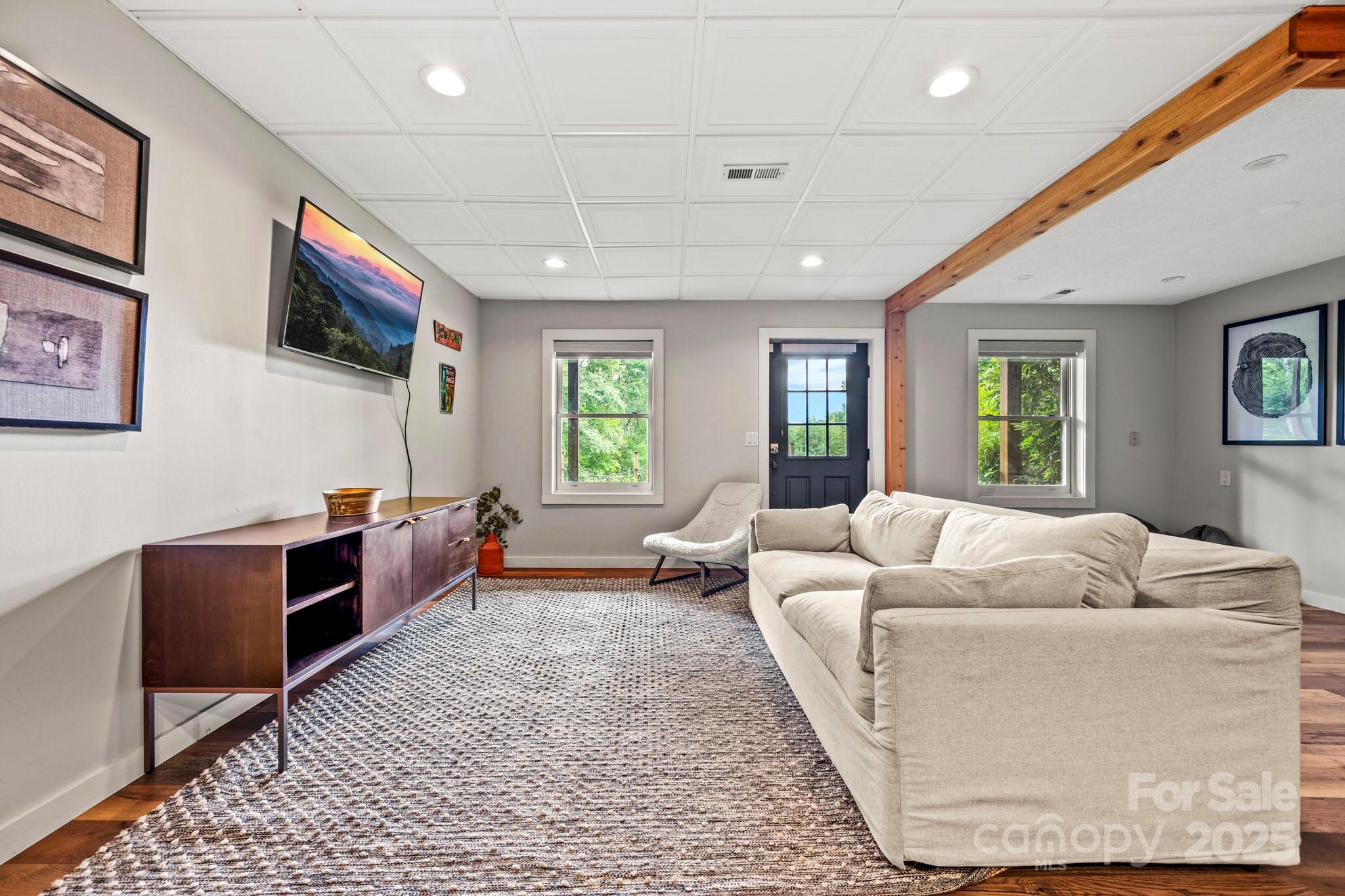 1933 Laurel Ridge North Maggie Valley, NC 28751 - Photo 41 of 45 a living room with furniture and a flat screen tv