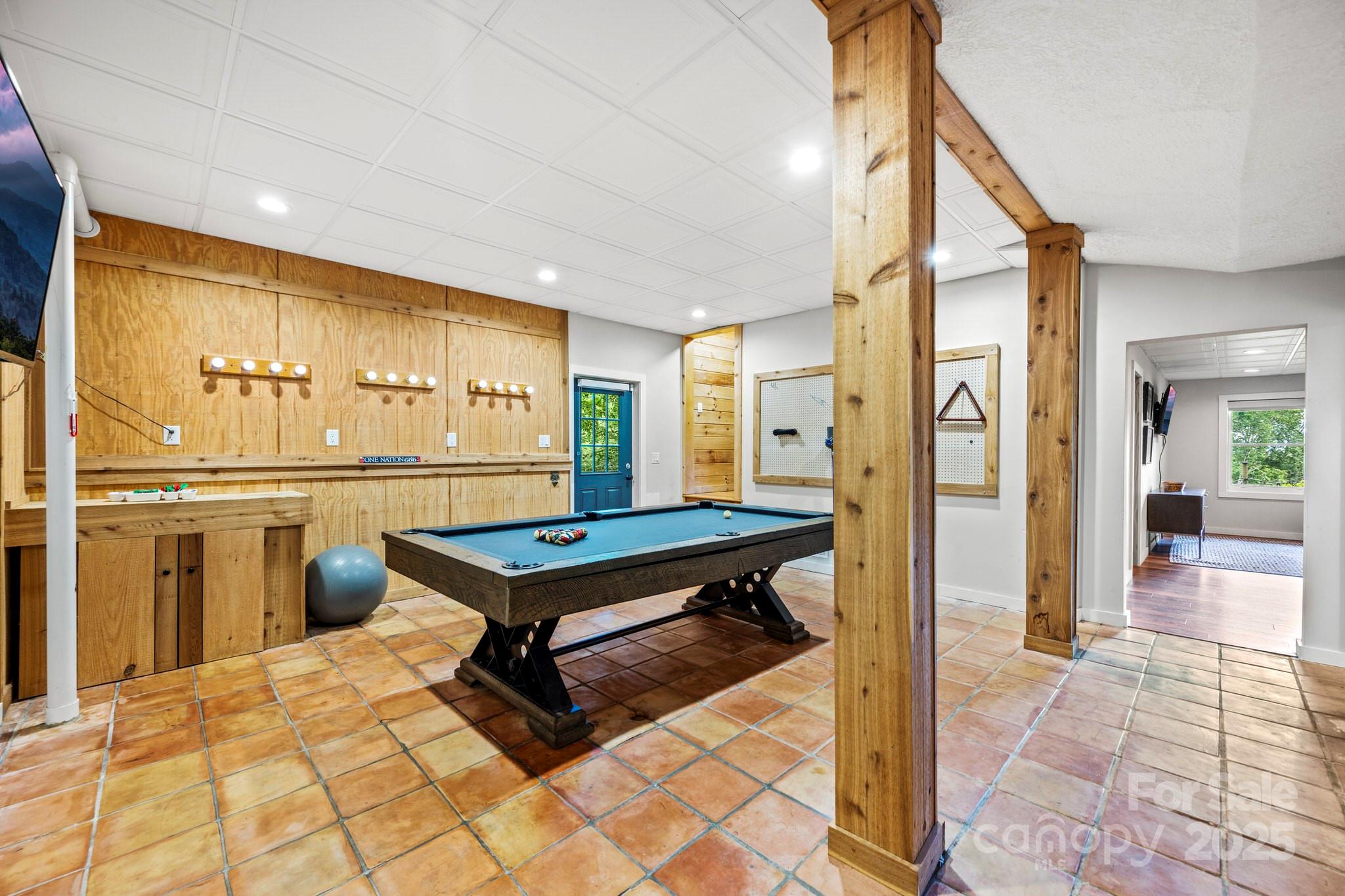 1933 Laurel Ridge North Maggie Valley, NC 28751 - Photo 45 of 45 a living room with a table tennis table and glass door
