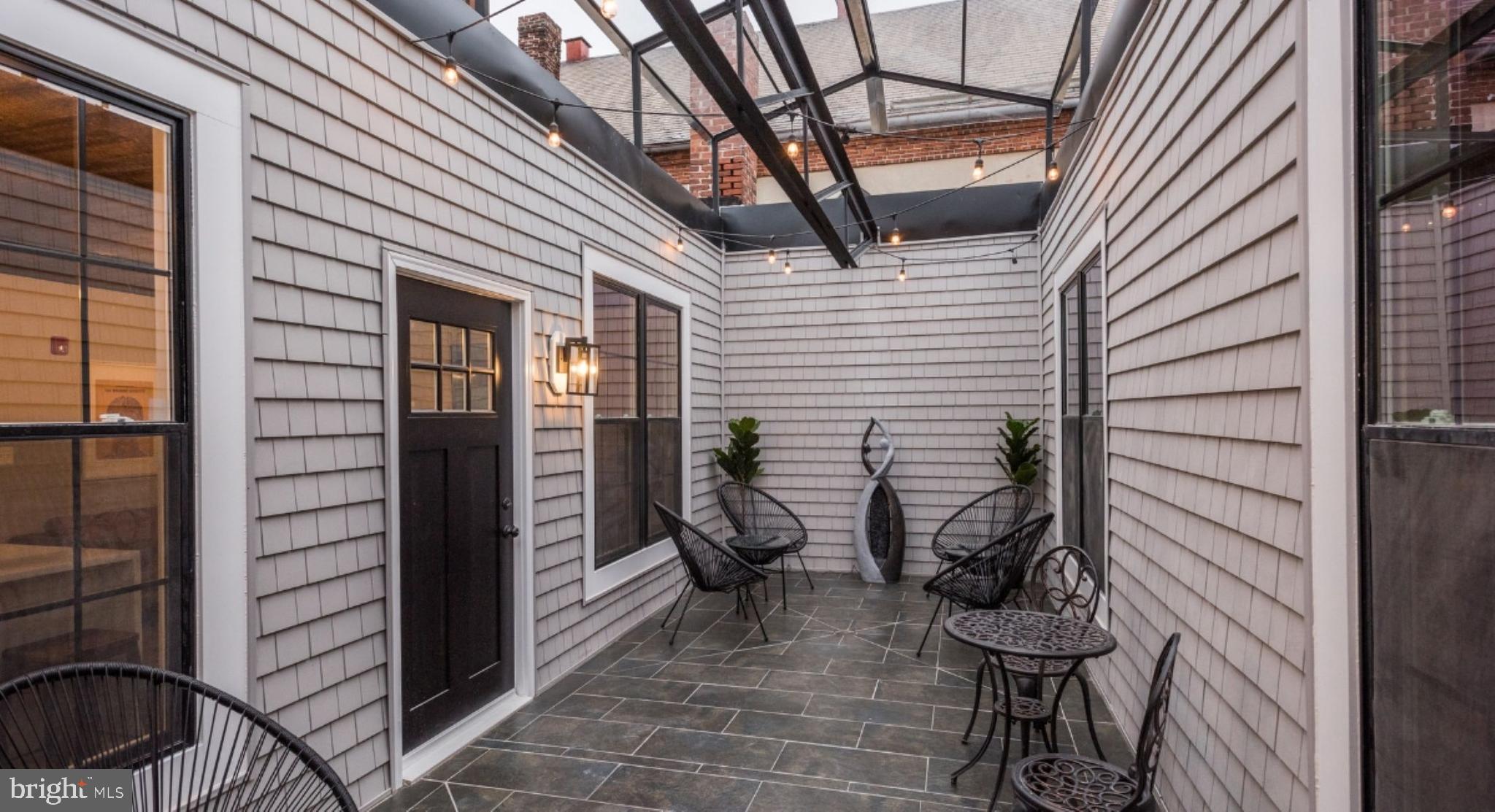 1702 Light Street, Unit 302 Baltimore, MD 21230 - Photo 16 of 16 a view of a porch with seating space