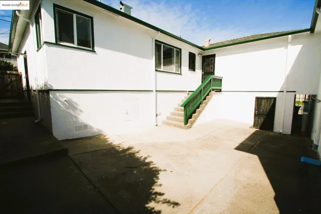 a utility room with cabinets washer and dryer
