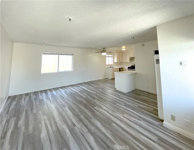 a view of a kitchen with wooden floor