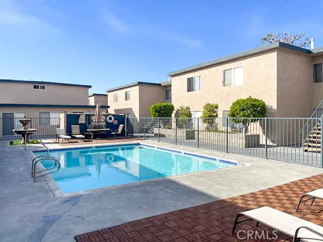 a view of a kitchen with kitchen island and a stove