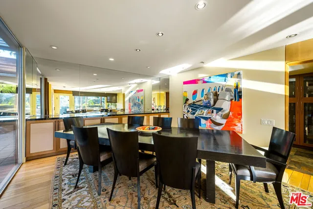 a kitchen with stainless steel appliances granite countertop a sink a stove and a microwave oven