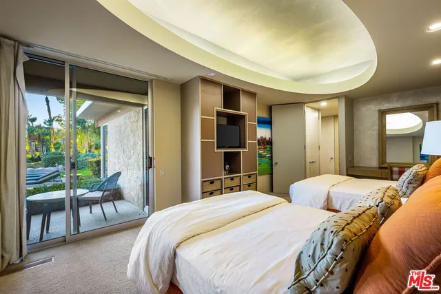 a living room with furniture and flat screen tv