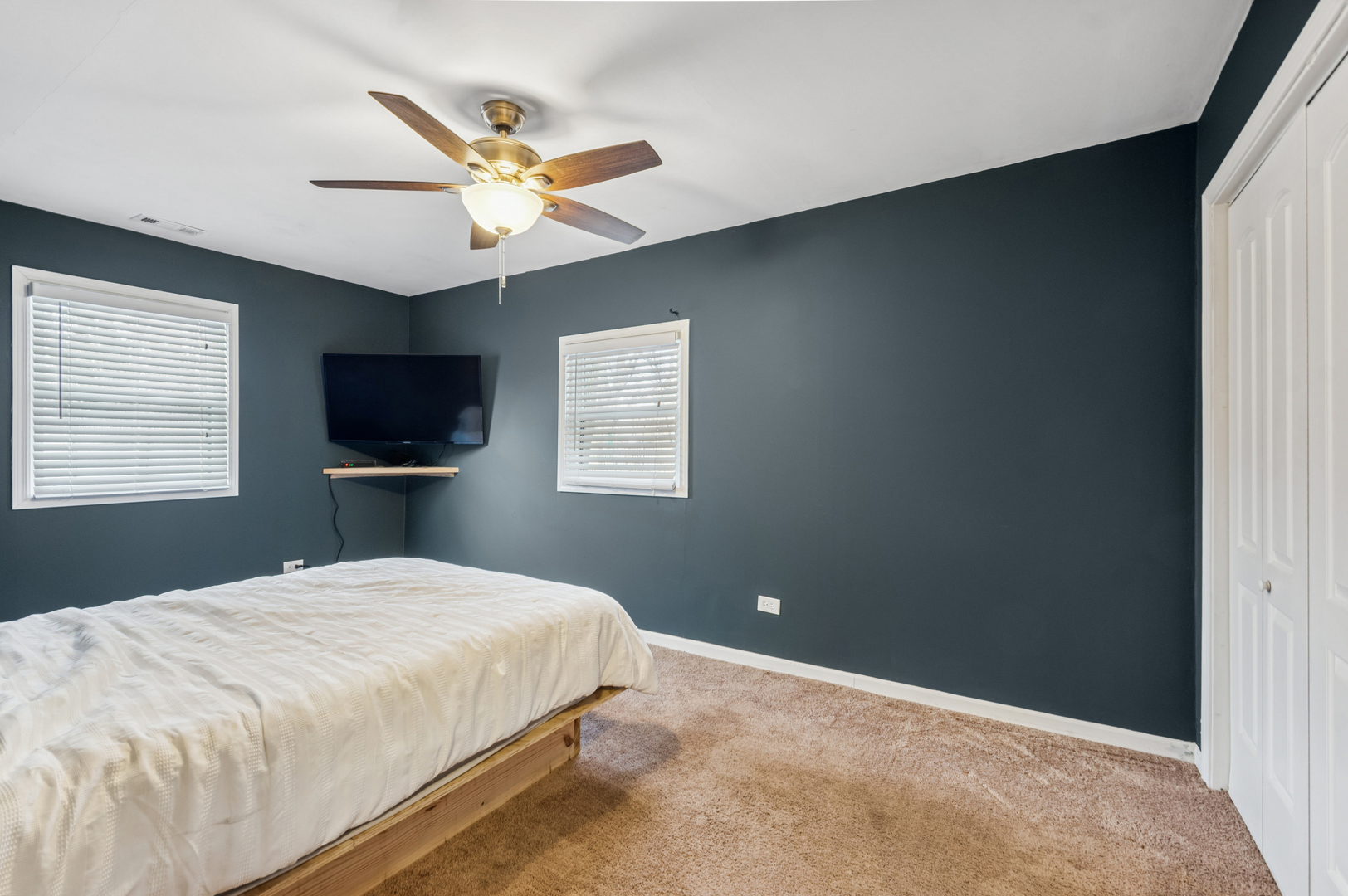 2113 Highwood Road McHenry, IL 60051 - Photo 12 of 18 a bedroom with a bed and a flat screen tv