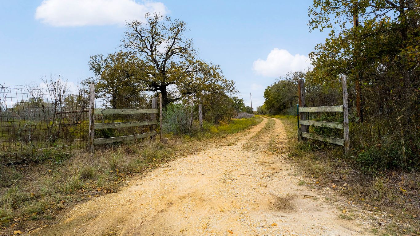 2124 Bugtussle Lane Luling, TX 78648 - Photo 2 of 25 a view of backyard with green space