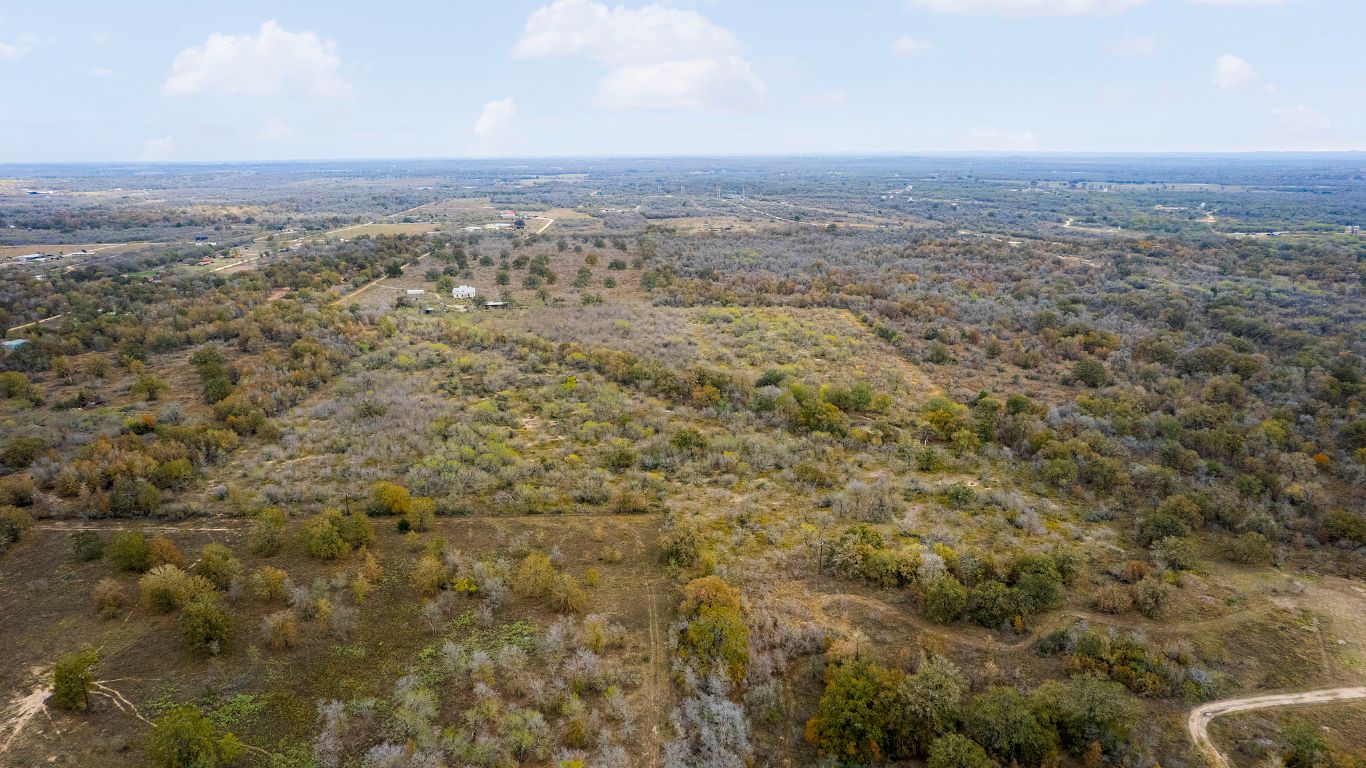 2124 Bugtussle Lane Luling, TX 78648 - Photo 23 of 25 an aerial view of residential houses with outdoor space