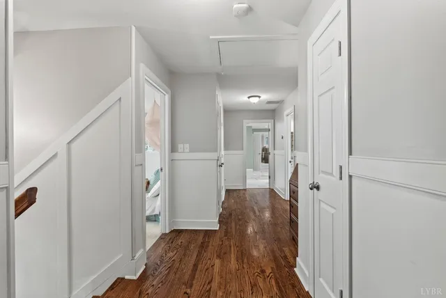 a living room with furniture and a gym machine