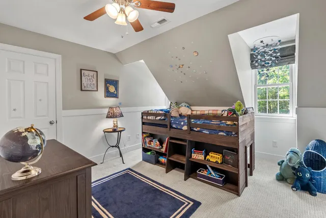 a living room with furniture flat screen tv and a fireplace