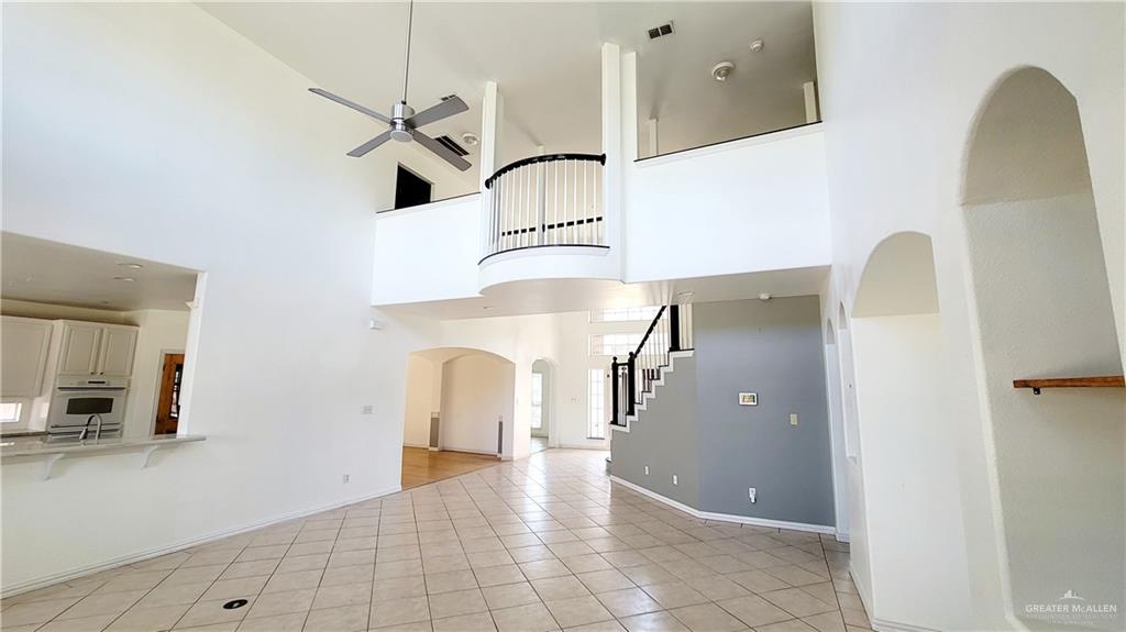 3003 El Jardin Street Mission, TX 78572 - Photo 11 of 25 a view of a hallway with entryway wooden floor and front door