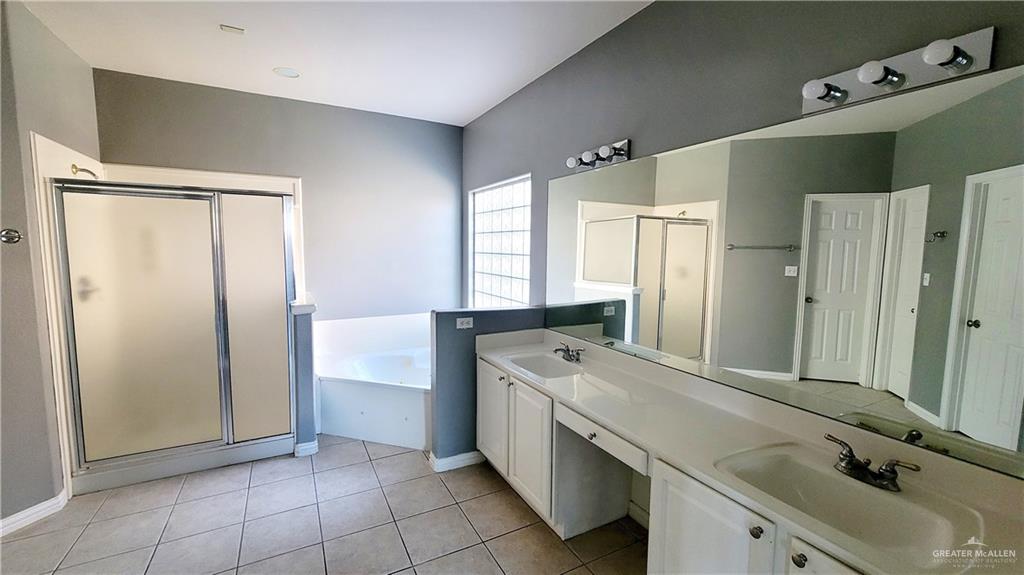 3003 El Jardin Street Mission, TX 78572 - Photo 12 of 25 a bathroom with a tub sink and mirror
