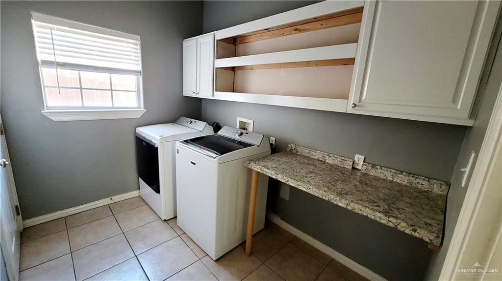 3003 El Jardin Street Mission, TX 78572 - Photo 14 of 25 a utility room with dryer and washer