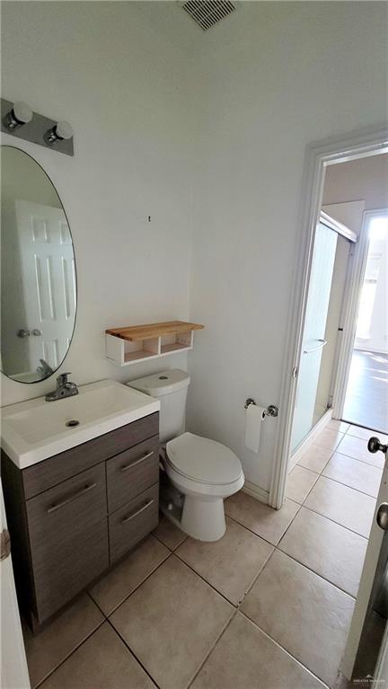 3003 El Jardin Street Mission, TX 78572 - Photo 15 of 25 a bathroom with a toilet sink and mirror