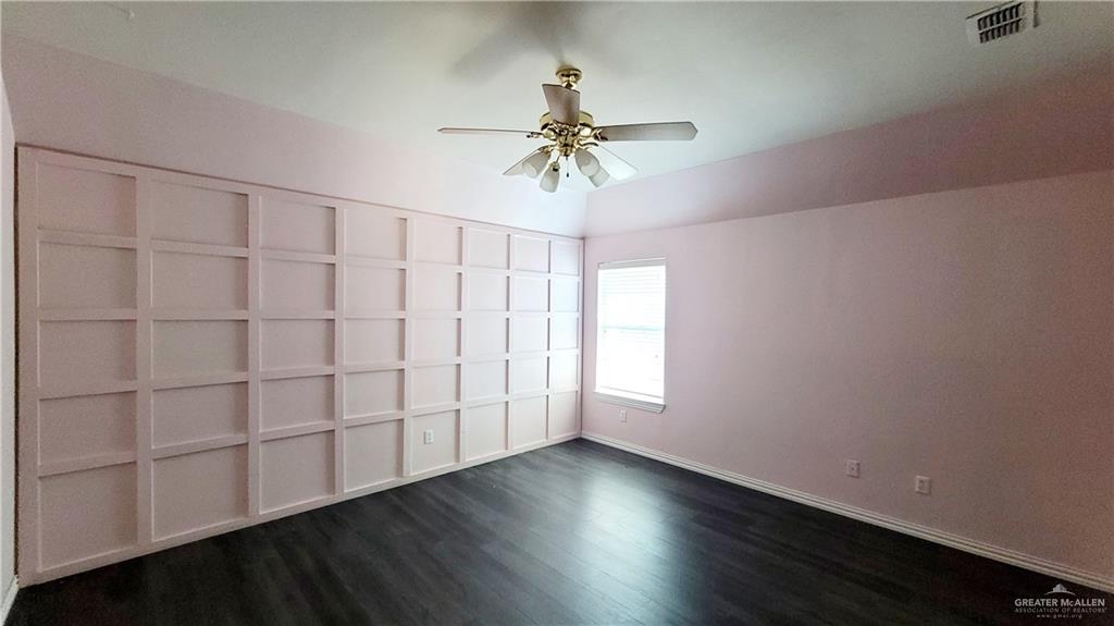 3003 El Jardin Street Mission, TX 78572 - Photo 22 of 25 wooden floor in an empty room with a window