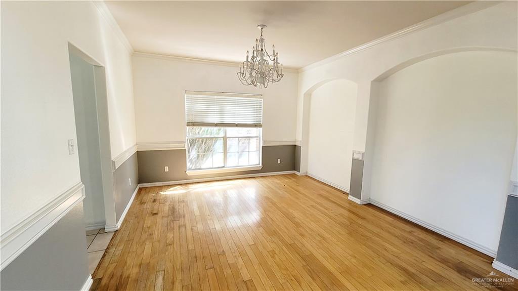 3003 El Jardin Street Mission, TX 78572 - Photo 5 of 25 wooden floor in an empty room with a window