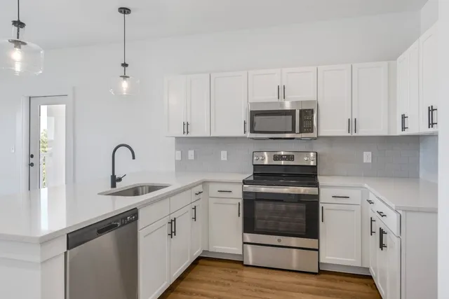 a view of kitchen with wooden floor
