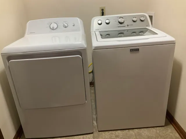 a bathroom with a toilet a sink and shower