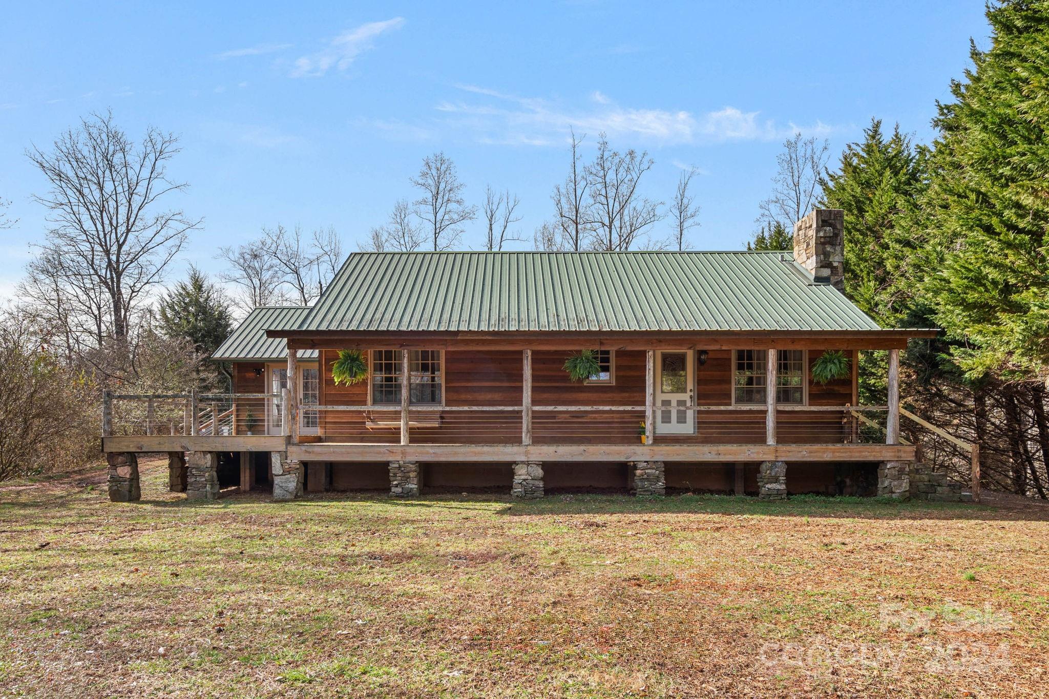 356 Eupeptic Springs Road Olin, NC 28660 - Photo 1 of 48 a front view of a house with a yard