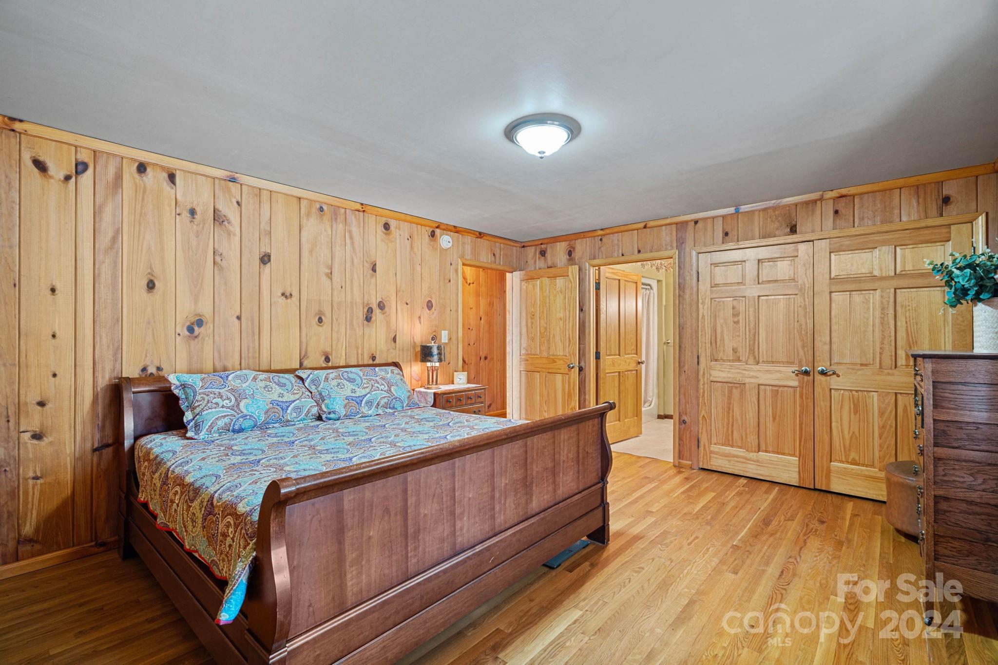 356 Eupeptic Springs Road Olin, NC 28660 - Photo 11 of 48 a bed sitting in a spacious bedroom next to a window
