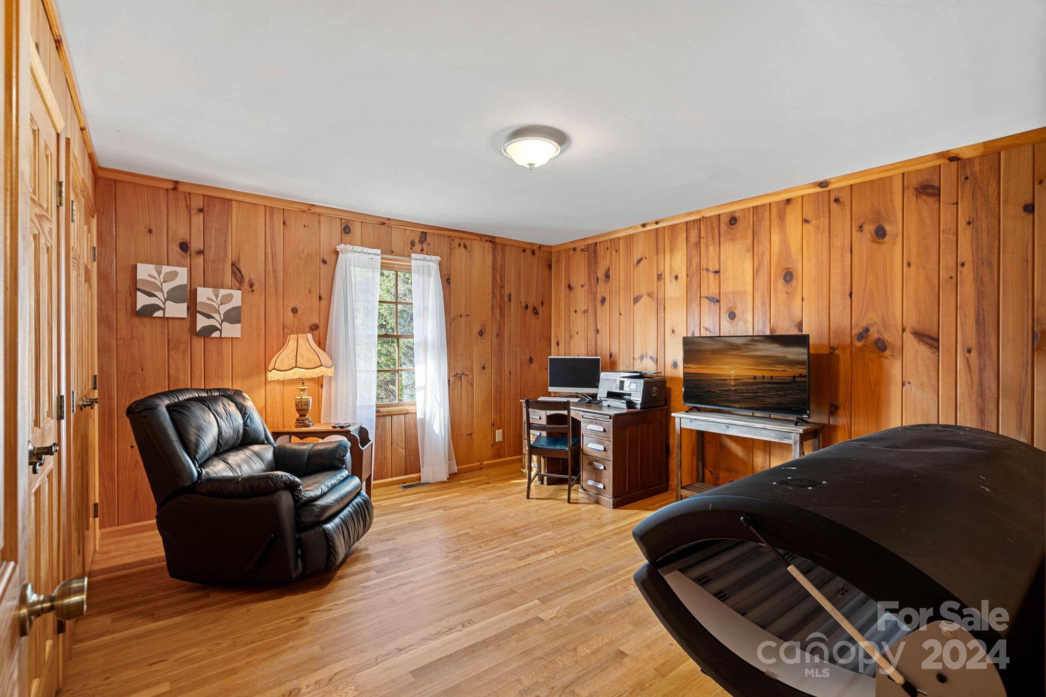 356 Eupeptic Springs Road Olin, NC 28660 - Photo 14 of 48 a living room with furniture fireplace and flat screen tv