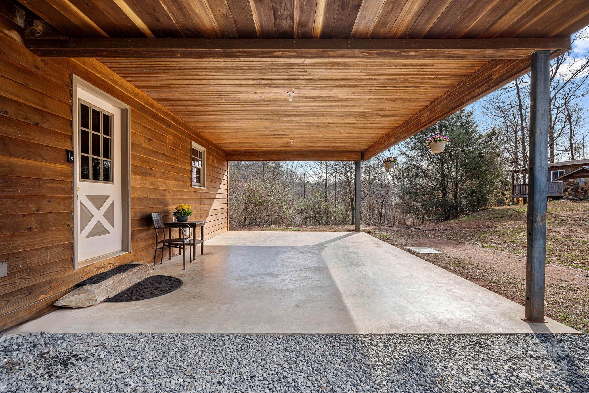 356 Eupeptic Springs Road Olin, NC 28660 - Photo 24 of 48 a backyard of a house with table and chairs