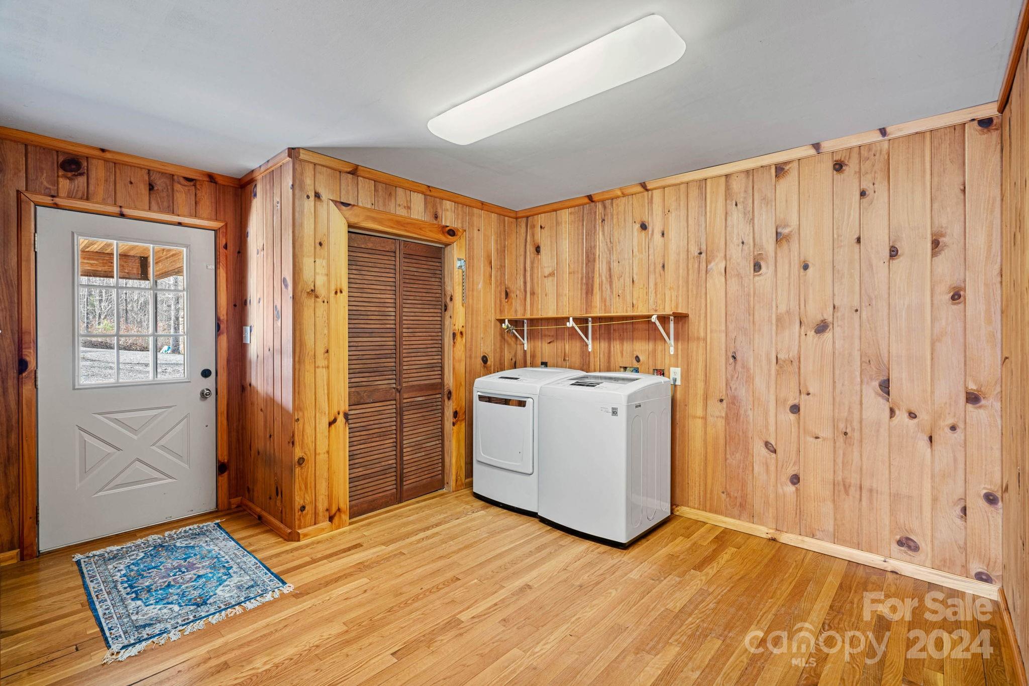 356 Eupeptic Springs Road Olin, NC 28660 - Photo 8 of 48 a view of utility room with closet and wooden floor