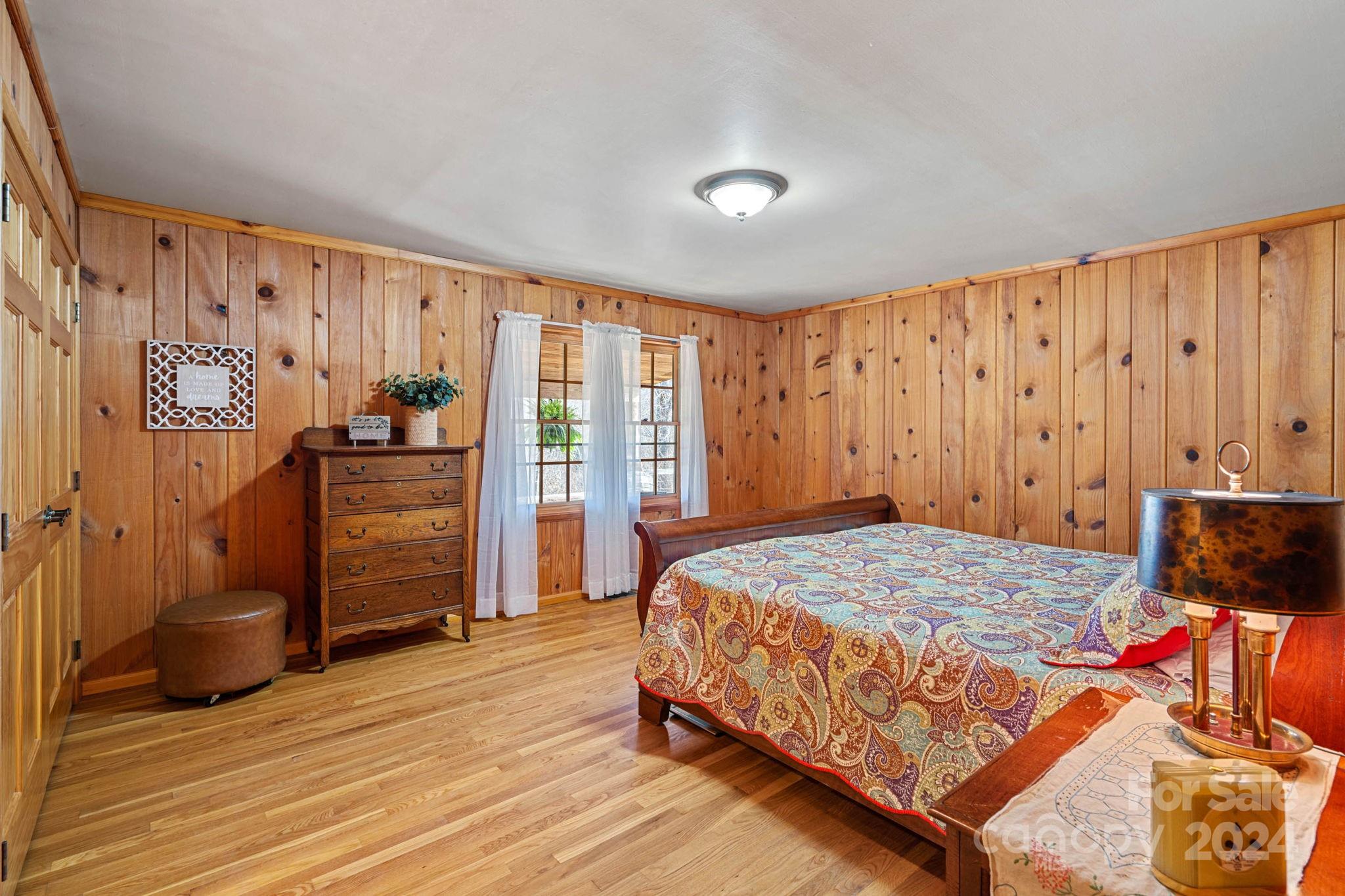 356 Eupeptic Springs Road Olin, NC 28660 - Photo 10 of 48 a bedroom with a bed and wooden floor