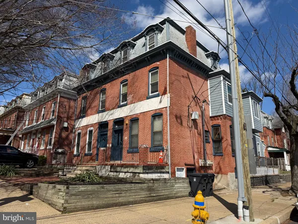 a view of a house with a street