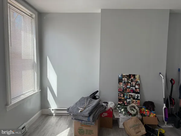 a living room with furniture and a walk in closet
