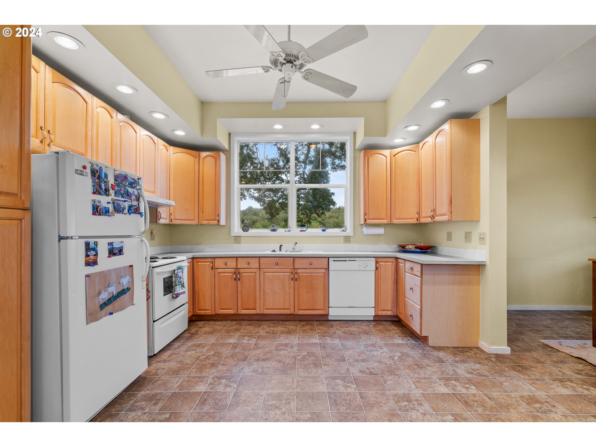 26413 Franklin Road Junction City, OR 97448 - Photo 19 of 44 a kitchen with stainless steel appliances kitchen island granite countertop a refrigerator and a sink