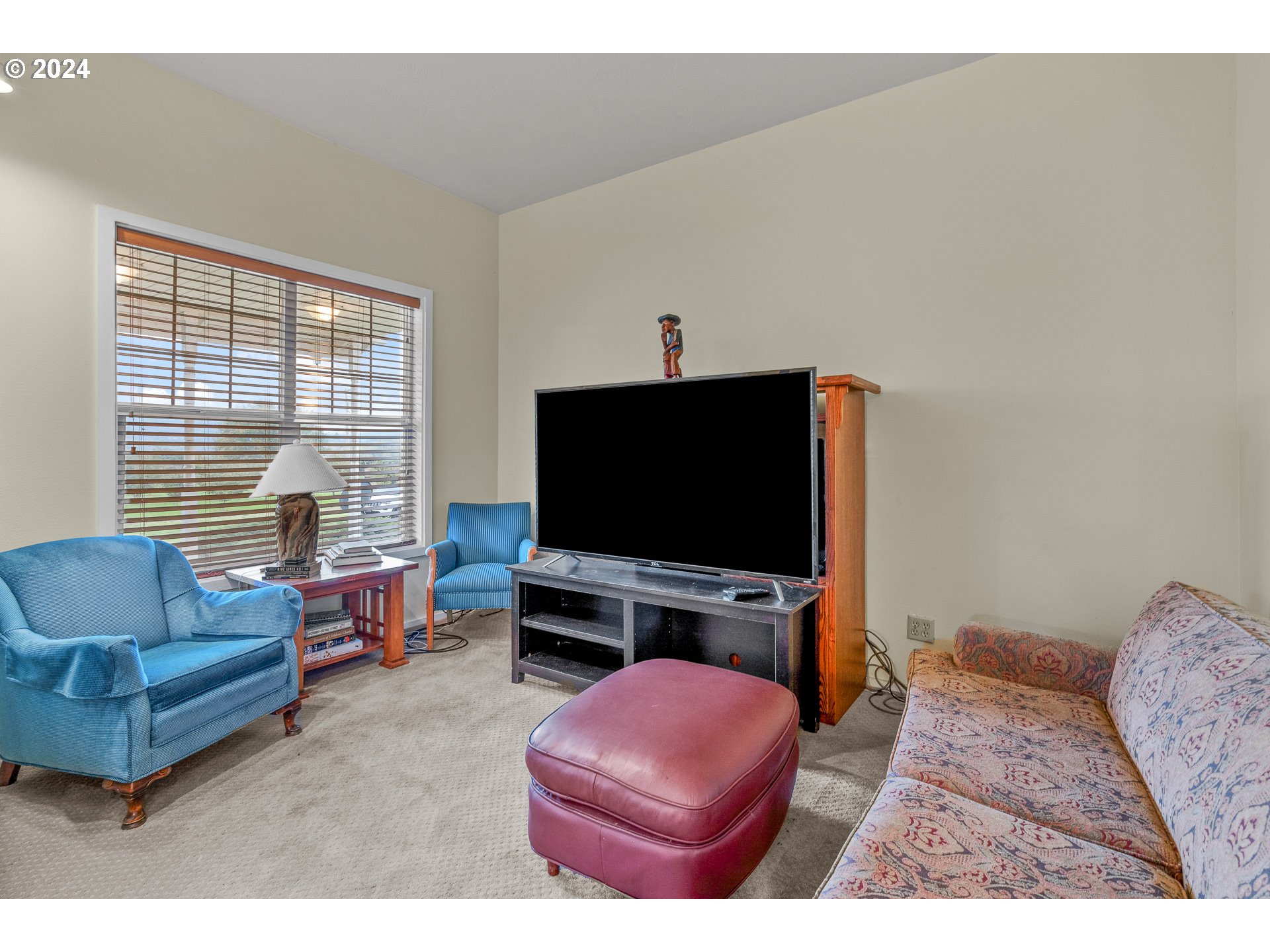 26413 Franklin Road Junction City, OR 97448 - Photo 22 of 44 a living room with furniture and a flat screen tv