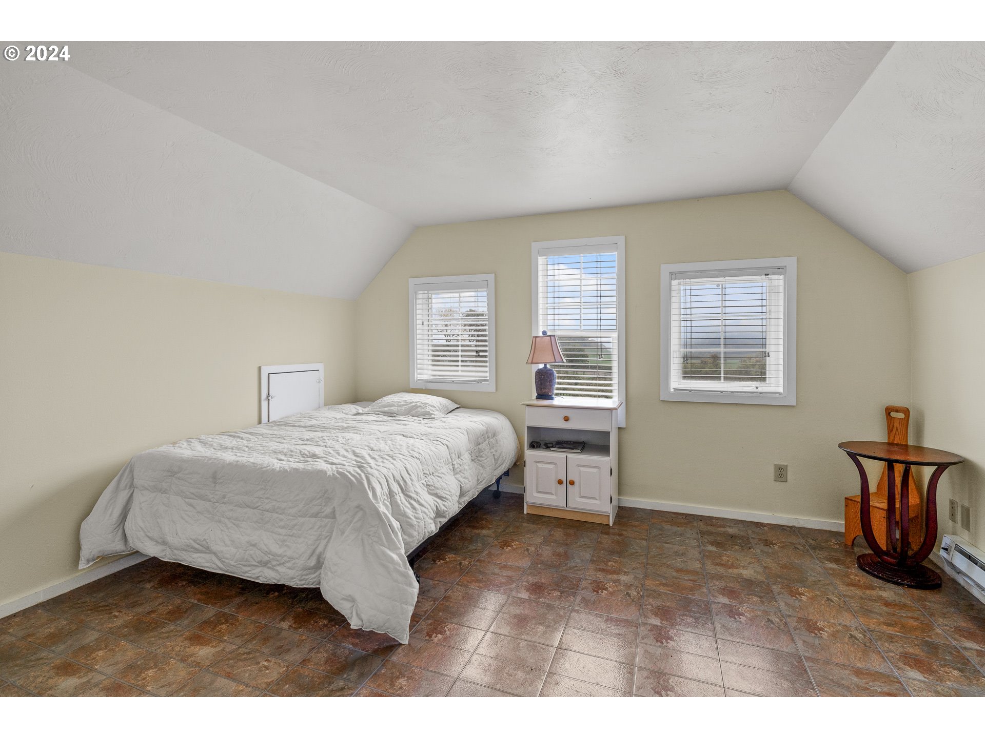 26413 Franklin Road Junction City, OR 97448 - Photo 25 of 44 a spacious bedroom with a bed and a window