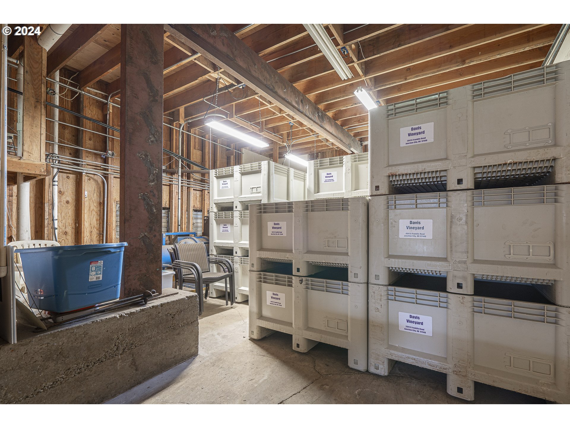 26413 Franklin Road Junction City, OR 97448 - Photo 39 of 44 a kitchen with stainless steel appliances kitchen island granite countertop a refrigerator and a stove