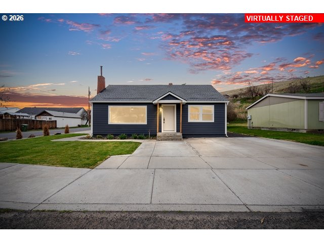 420 Water Street Heppner, OR 97836 - Photo 2 of 48 a front view of a house with a yard and garage