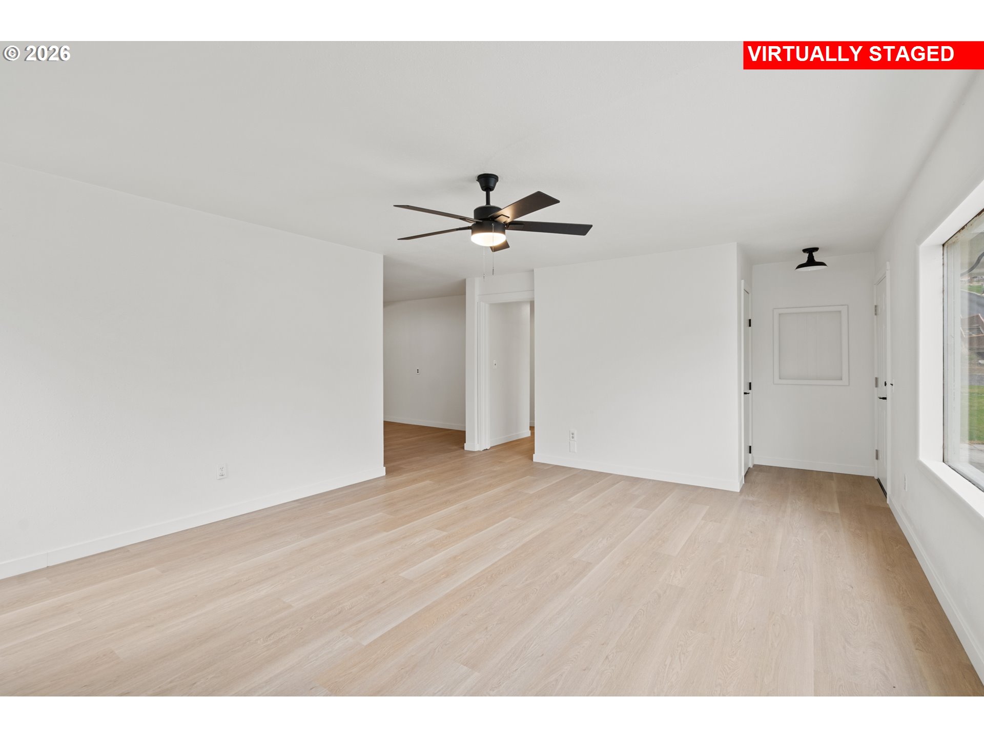 420 Water Street Heppner, OR 97836 - Photo 5 of 48 a view of an empty room with a ceiling fan