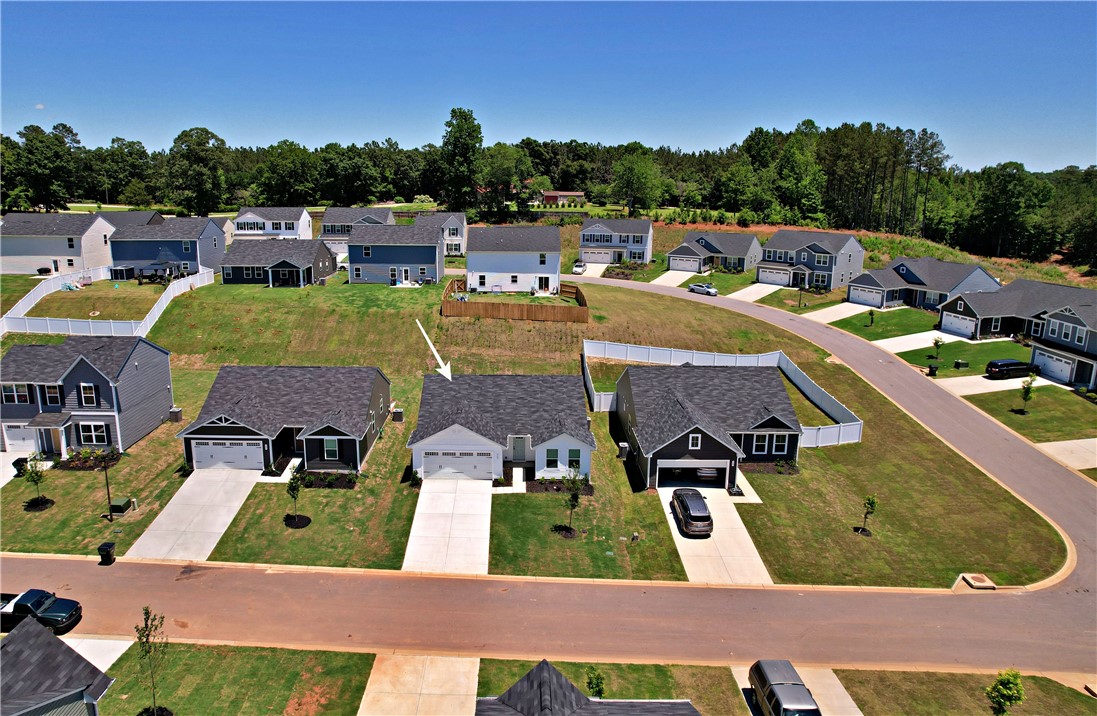723 Peridot Way Westminster, SC 29693 - Photo 39 of 45 An aerial perspective showcases a vibrant neighborhood with well-maintained green spaces and clear blue skies.
