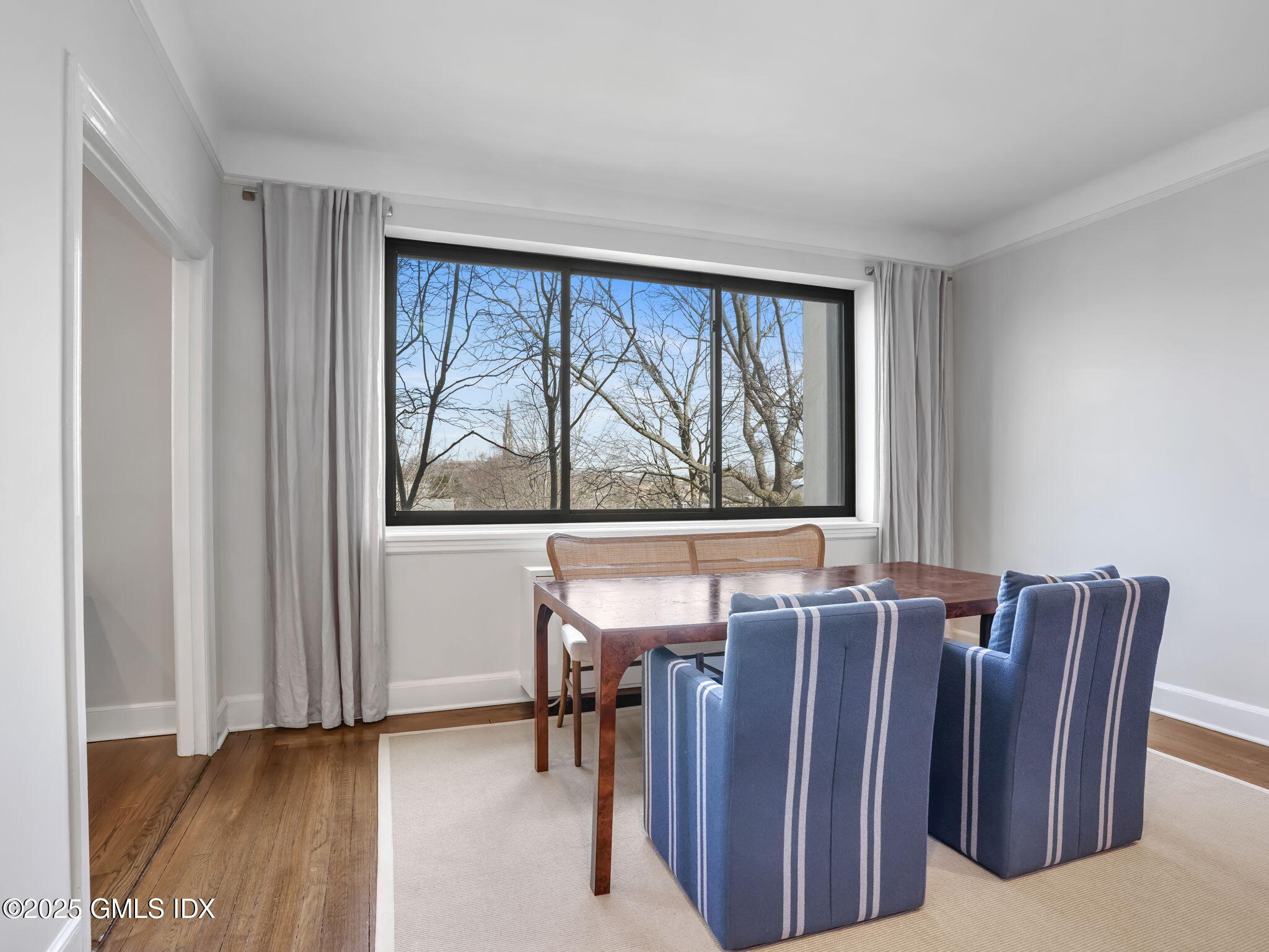 47 Lafayette Place, Unit 3H Greenwich, CT 06830 - Photo 6 of 18 a view of a two room with furniture window and outside view