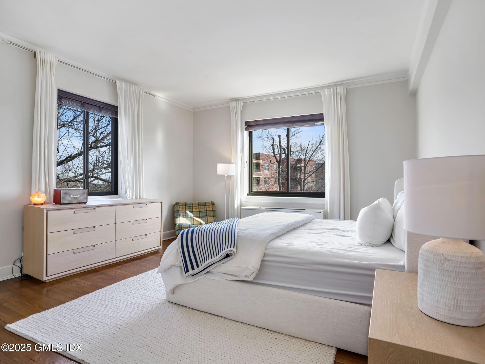 47 Lafayette Place, Unit 3H Greenwich, CT 06830 - Photo 9 of 18 a bedroom with a bed and a window