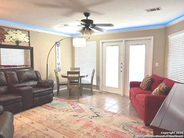 a living room with furniture and a large window