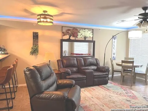 a living room with furniture and a window