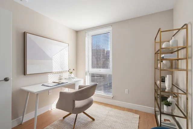 a dining room with furniture and window