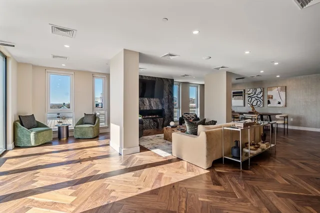 a living room with furniture and a table